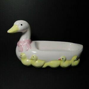 Vintage ceramic duck w/ducklings and red bow around neck, soap dish.
